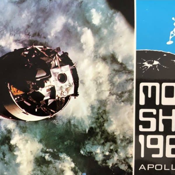 Image features a spacecraft orbiting Earth with a cloudy atmosphere. Beside it, a graphic displays "Moon Shot 1969 Apollo 11" with an illustration of a lunar module.