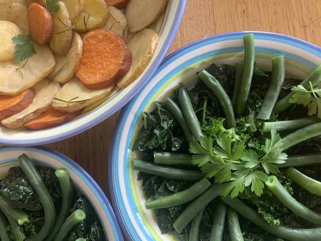 Roasted potatoes with rosemary and sweet potato with green beans and kale