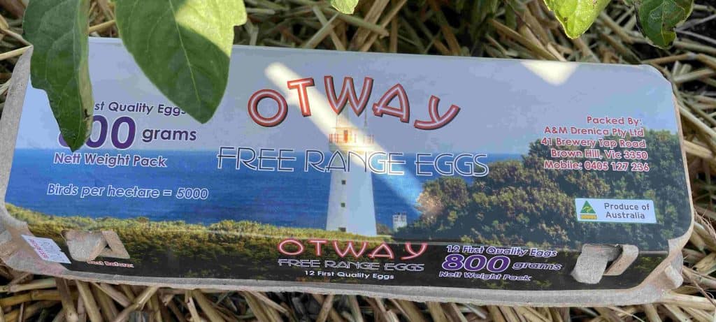 A carton of Otway Free Range Eggs with a lighthouse image on the label, perfect for those seeking sustainable food on the Great Ocean Walk.